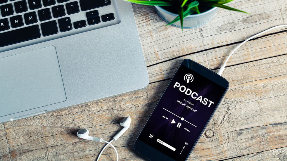 Everything you need to know about podcasts; laptop and smartphone